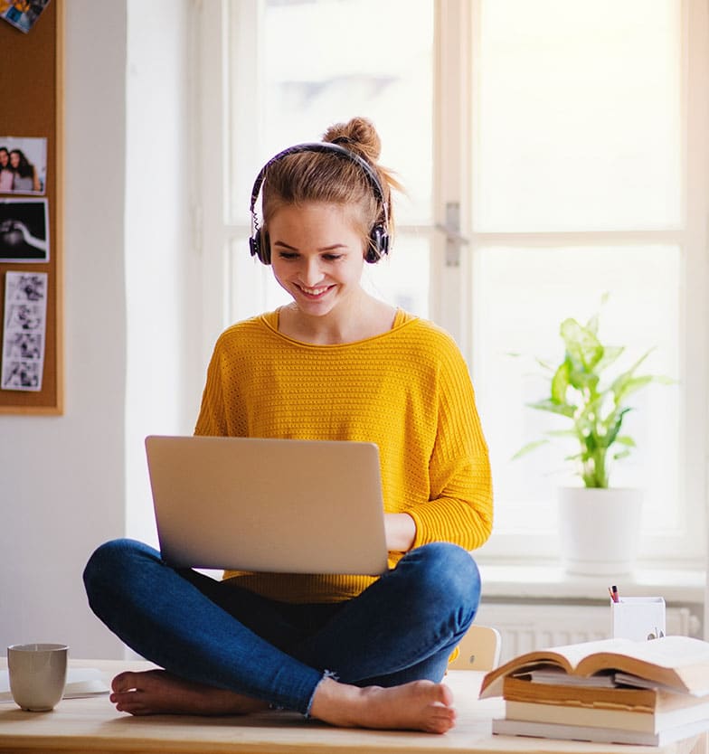 Teen girl on laptop computer in virtual IOP session