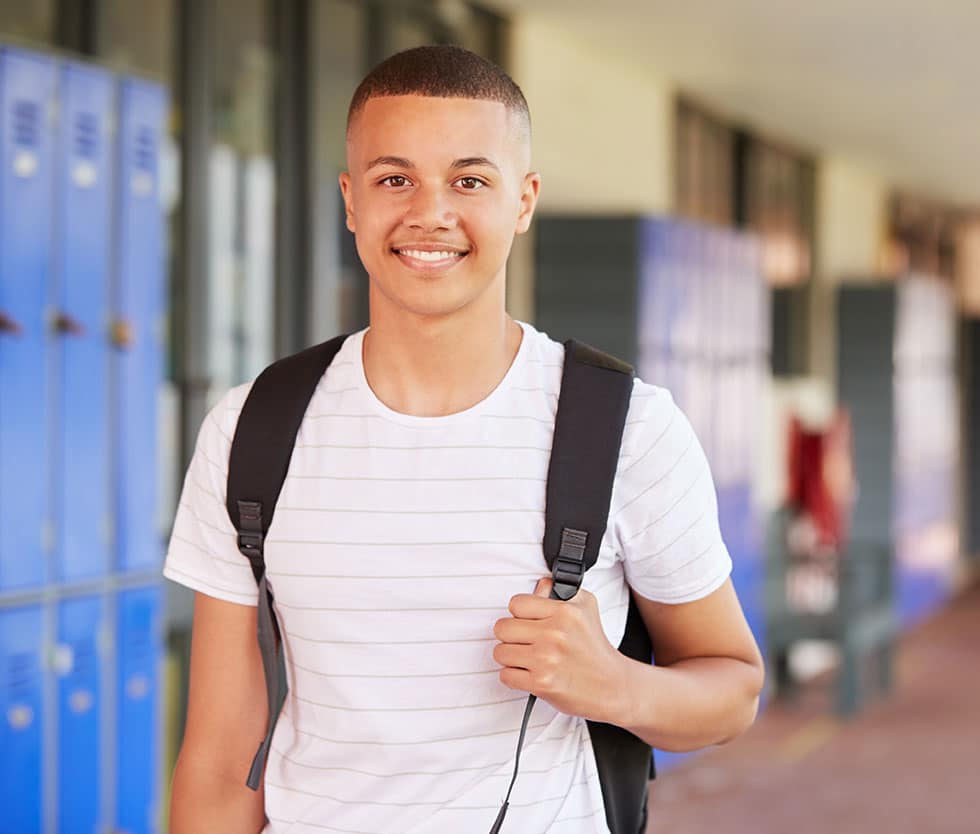 Teen boy at school struggling with substance abuse